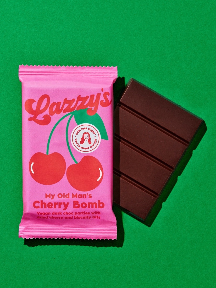 Cherry Bomb bar next to a piece of dark chocolate